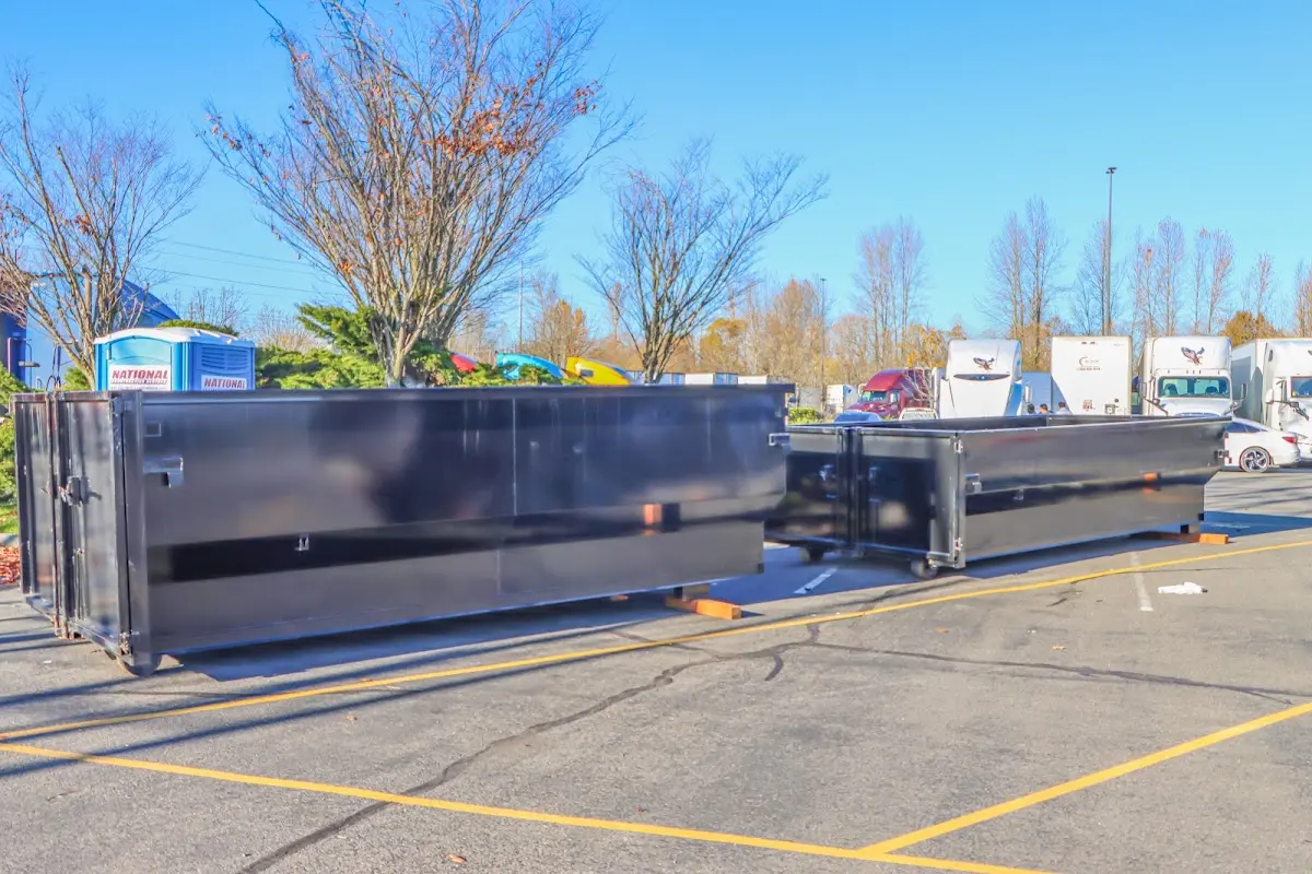 Professional dumpster rental service with roll-off container on residential driveway in North Merritt Island